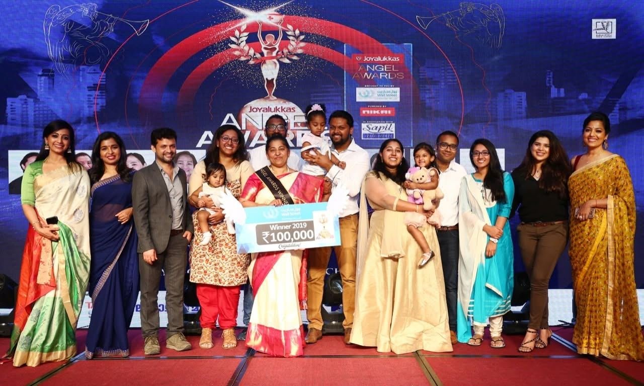 Joyalukkas Angel Awards 2019 winner on stage with her family and the hosts