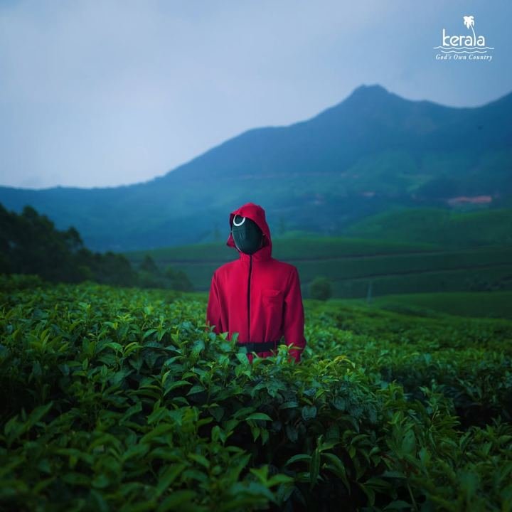 Squid Game pink soldier in Munnar's tea hills